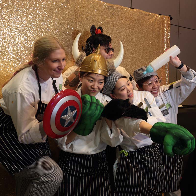 student chefs wearing costumes at the photo booth